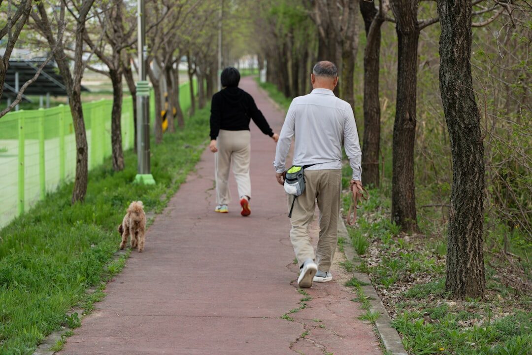 elderly people walking in park